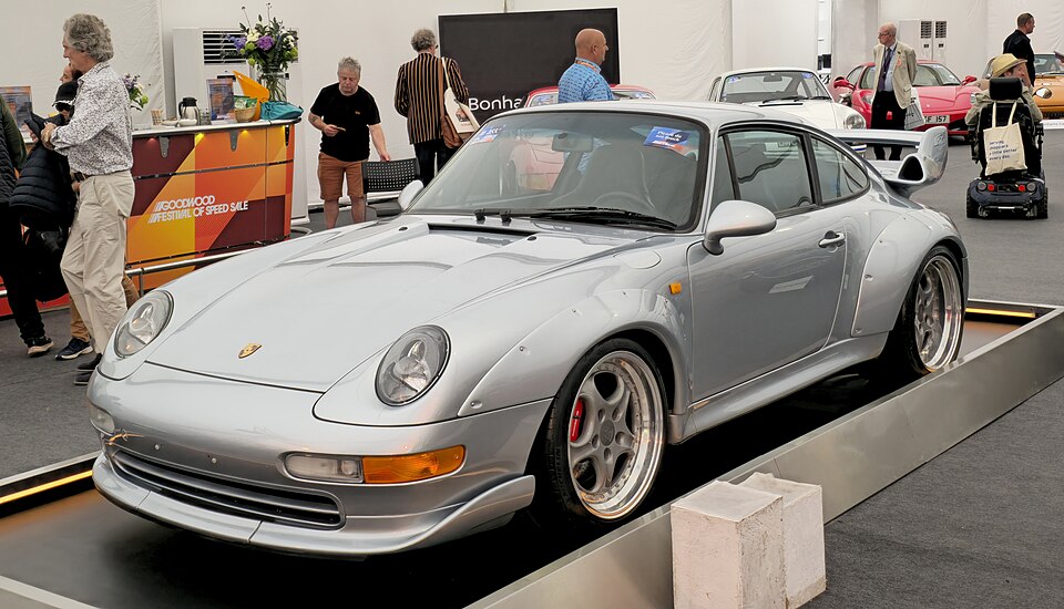 Silver Porsche 993 GT2 showing wide wheel-arch extensions and a fixed rear wing