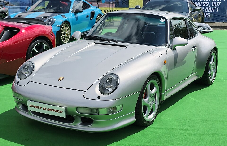 Silver Porsche 993 Turbo with its fixed rear wing